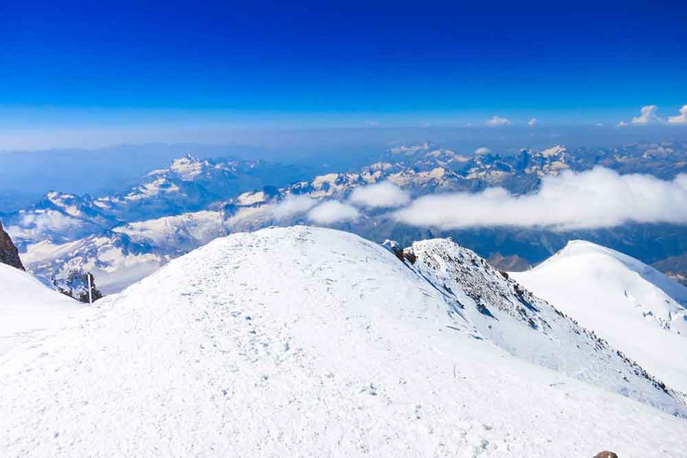 Mount Elbrus in Russia covered in a snow and ice offering a stunning view of the mountains and sky